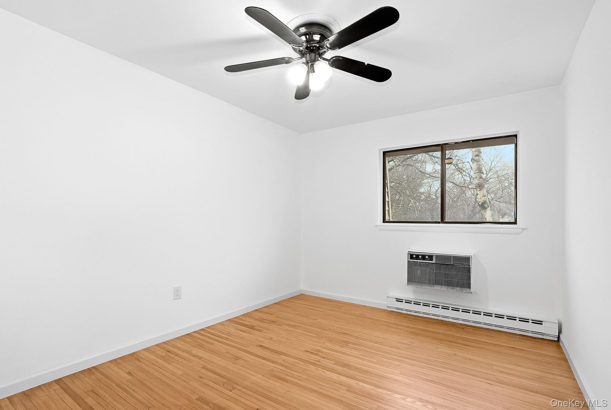 20 Pierces Road, Unit 36 Newburgh, NY 12550 - Photo 31 of 36 a view of empty room with wooden floor