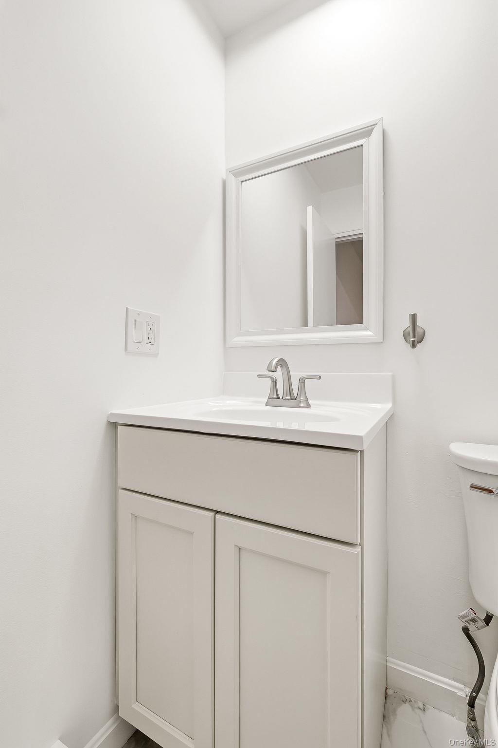 20 Pierces Road, Unit 36 Newburgh, NY 12550 - Photo 35 of 36 a bathroom with a sink toilet and mirror
