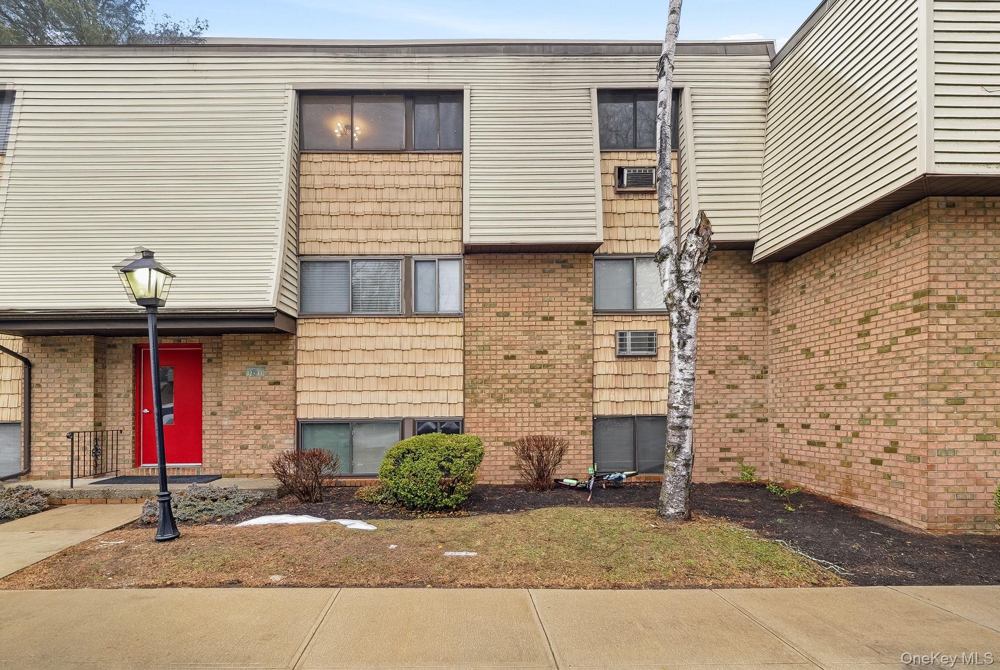 20 Pierces Road, Unit 36 Newburgh, NY 12550 - Photo 4 of 36 a front view of a house with a yard and garage
