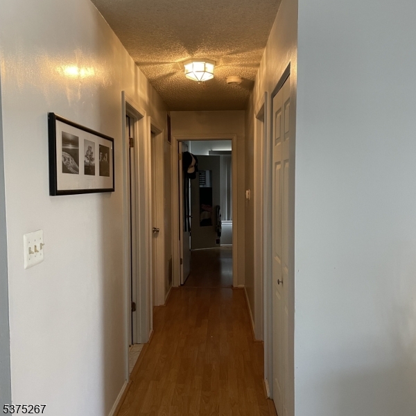 2512 Lindsley Road Bridgewater, NJ 08807 - Photo 37 of 39 a view of a hallway with wooden shelves