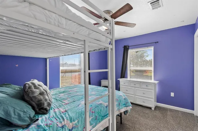 a bed room with a bed and a window