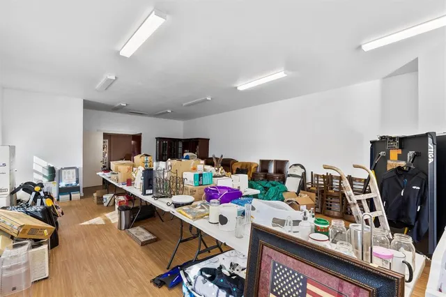 a view of a workspace with furniture and toys