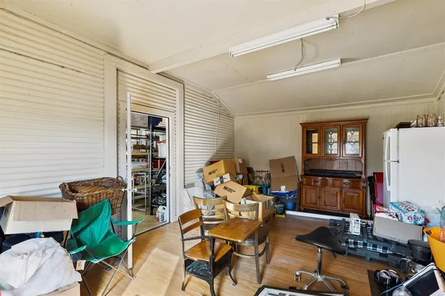 a room with furniture workspace and wooden floor