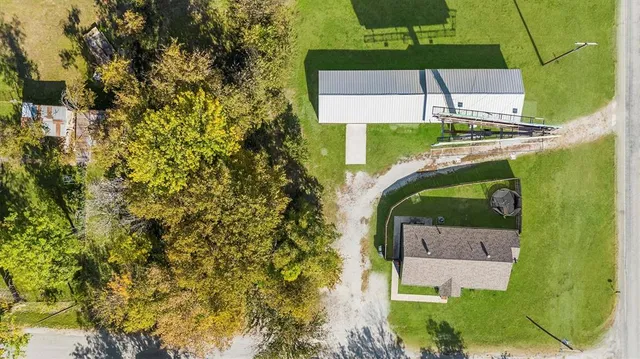 an aerial view of a house with outdoor space