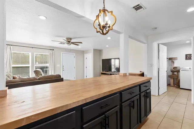 a view of a kitchen with a sink stainless steel appliances and cabinets