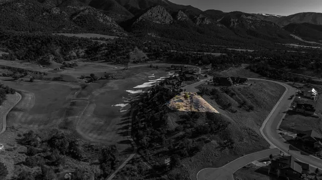 a view of a road with a building in the background