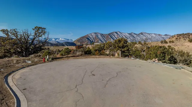 a view of a big house in front of the house