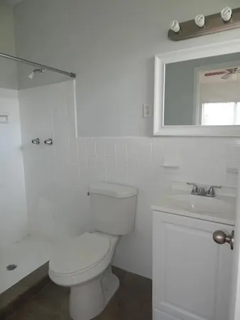 a bathroom with a toilet and a sink
