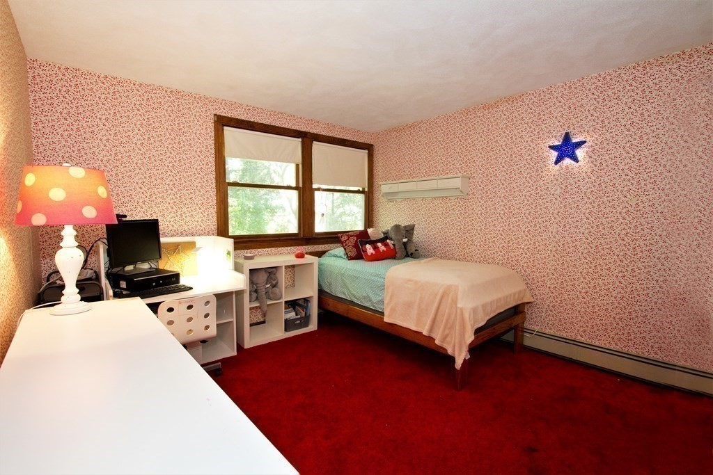 18 Boxford Road Topsfield, MA 01983 - Photo 16 of 25 a bed room with a bed window and a flat screen tv