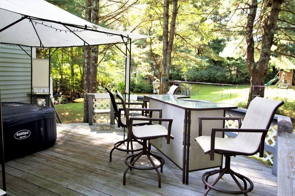 18 Boxford Road Topsfield, MA 01983 - Photo 23 of 25 a patio with glass top table and chairs