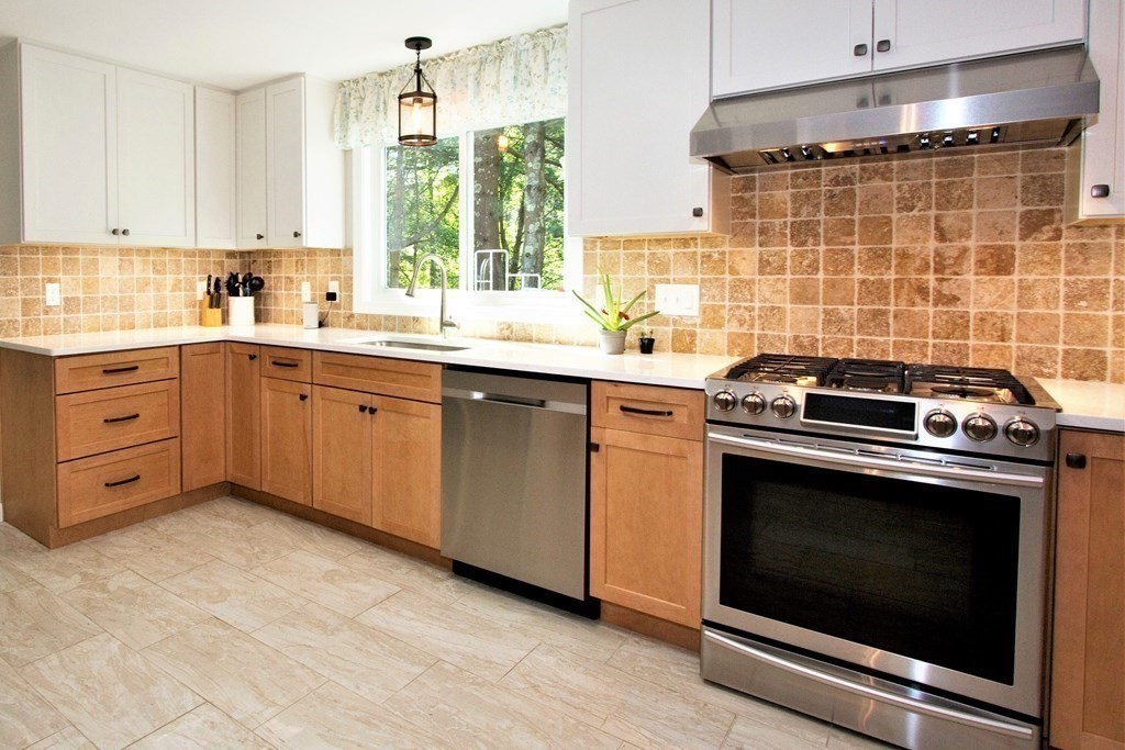 18 Boxford Road Topsfield, MA 01983 - Photo 3 of 25 a kitchen with a stove sink and cabinets