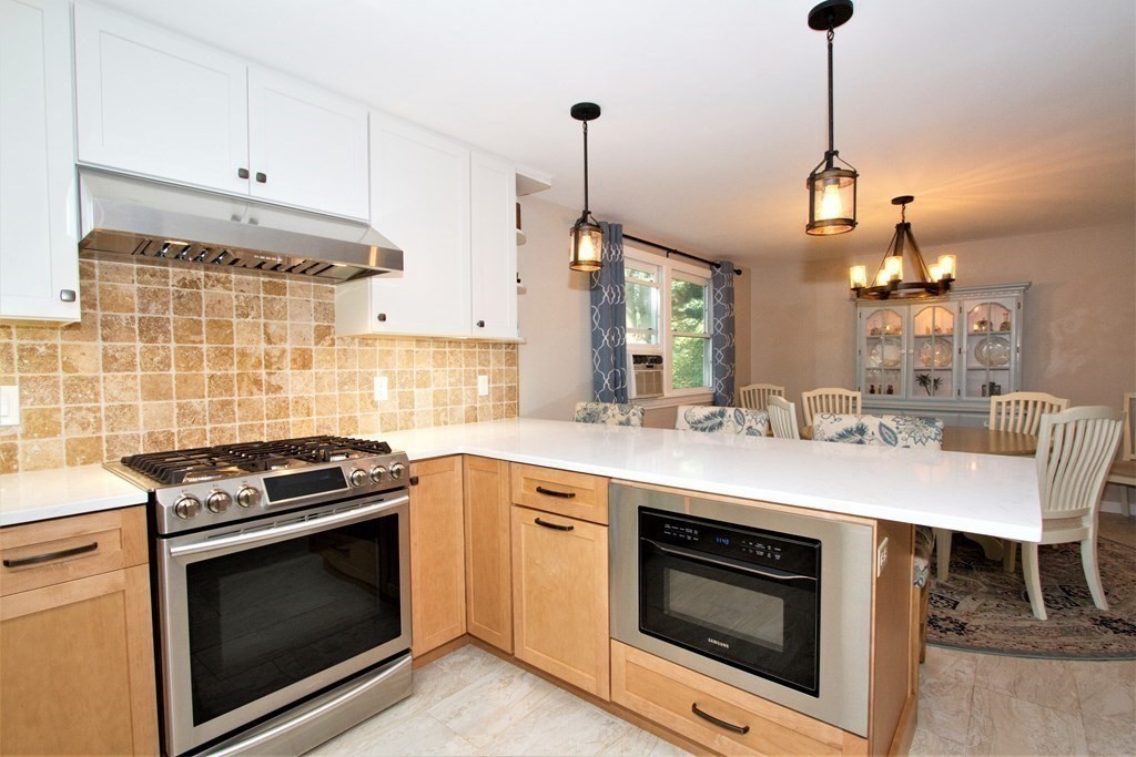 18 Boxford Road Topsfield, MA 01983 - Photo 6 of 25 a kitchen with a stove and a sink