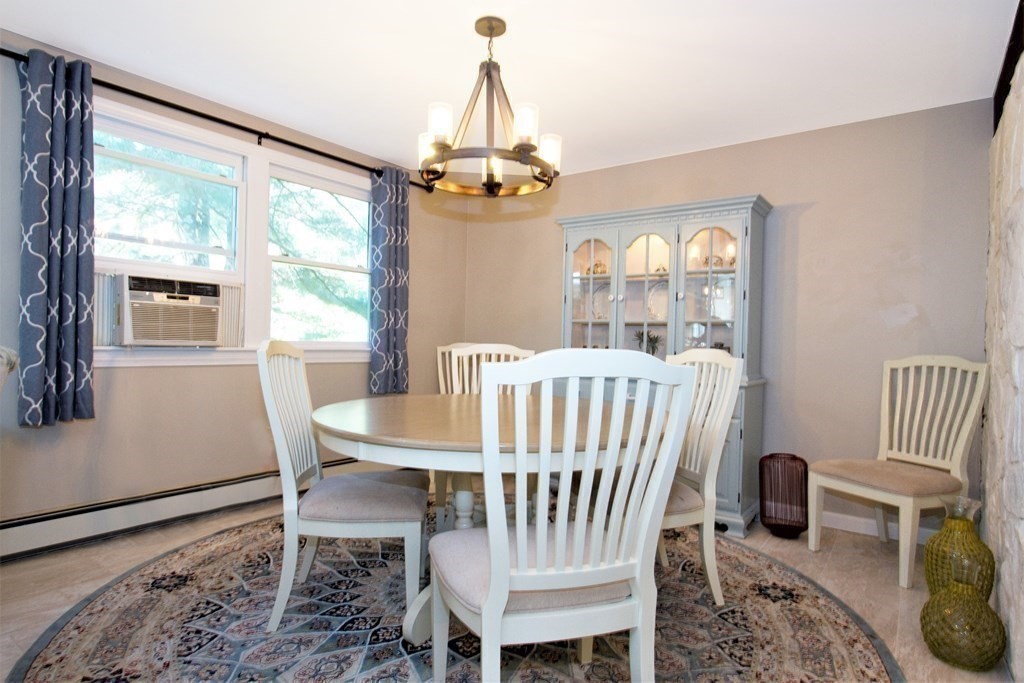 18 Boxford Road Topsfield, MA 01983 - Photo 8 of 25 a view of a dining room with furniture window and outside view