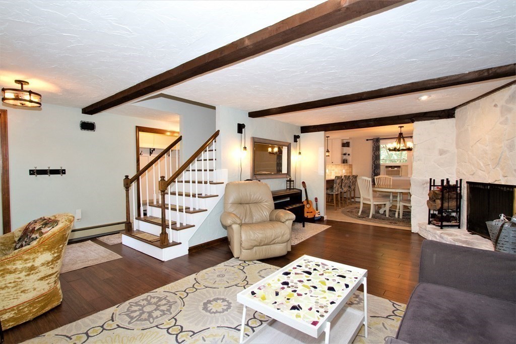 18 Boxford Road Topsfield, MA 01983 - Photo 9 of 25 a living room with furniture a rug and wooden floor