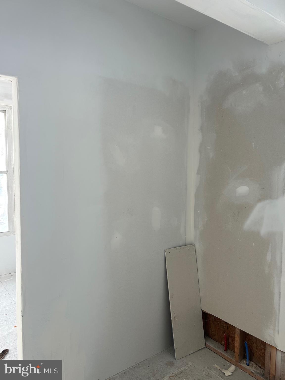 6600 Woodland Road Morningside, MD 20746 - Photo 62 of 100 a room with a white wall and a chair