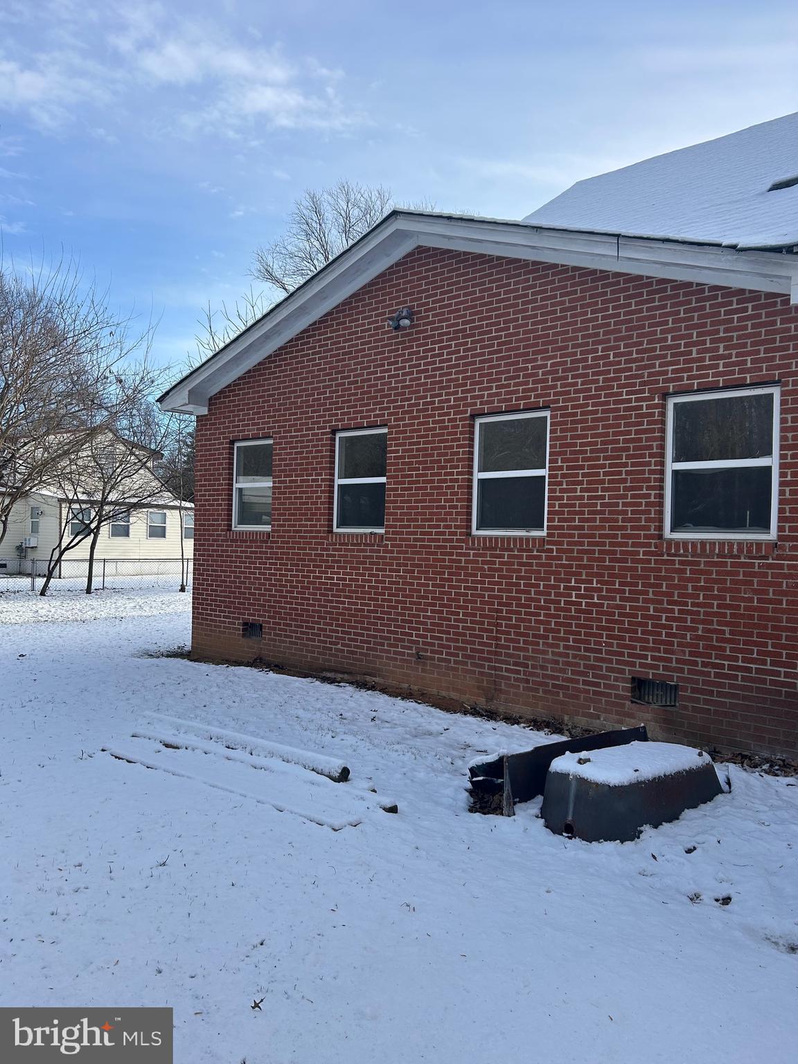 6600 Woodland Road Morningside, MD 20746 - Photo 8 of 100 a backyard of a house with fire pit and trees