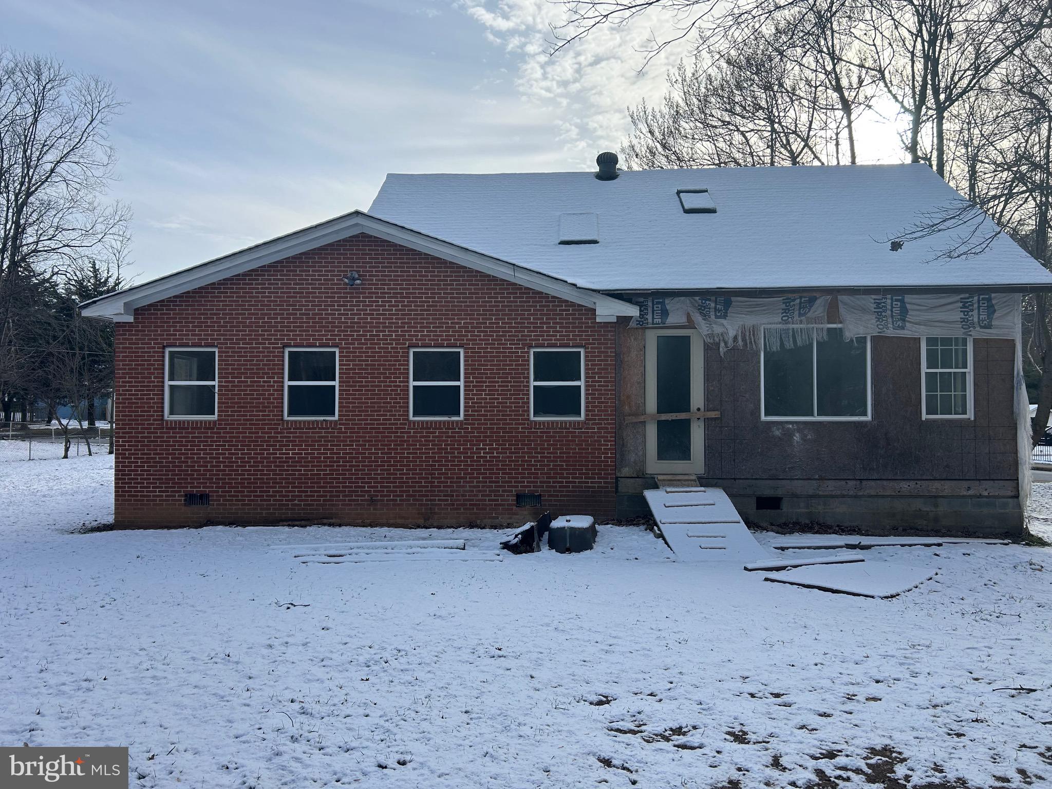 6600 Woodland Road Morningside, MD 20746 - Photo 9 of 100 a backyard of a house with barbeque oven and brick wall