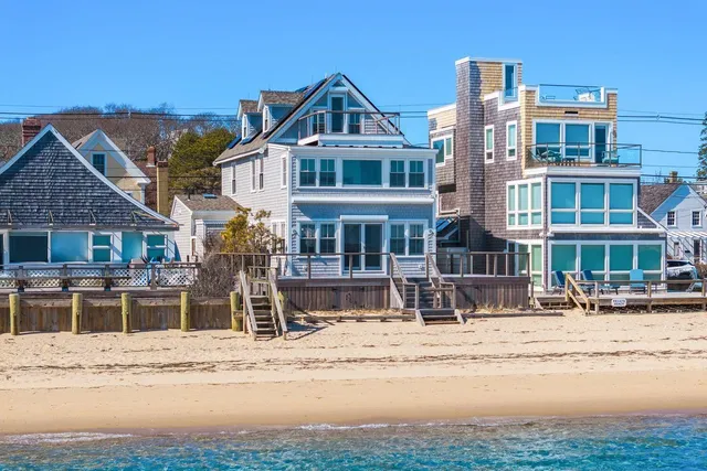 a front view of a building with a yard