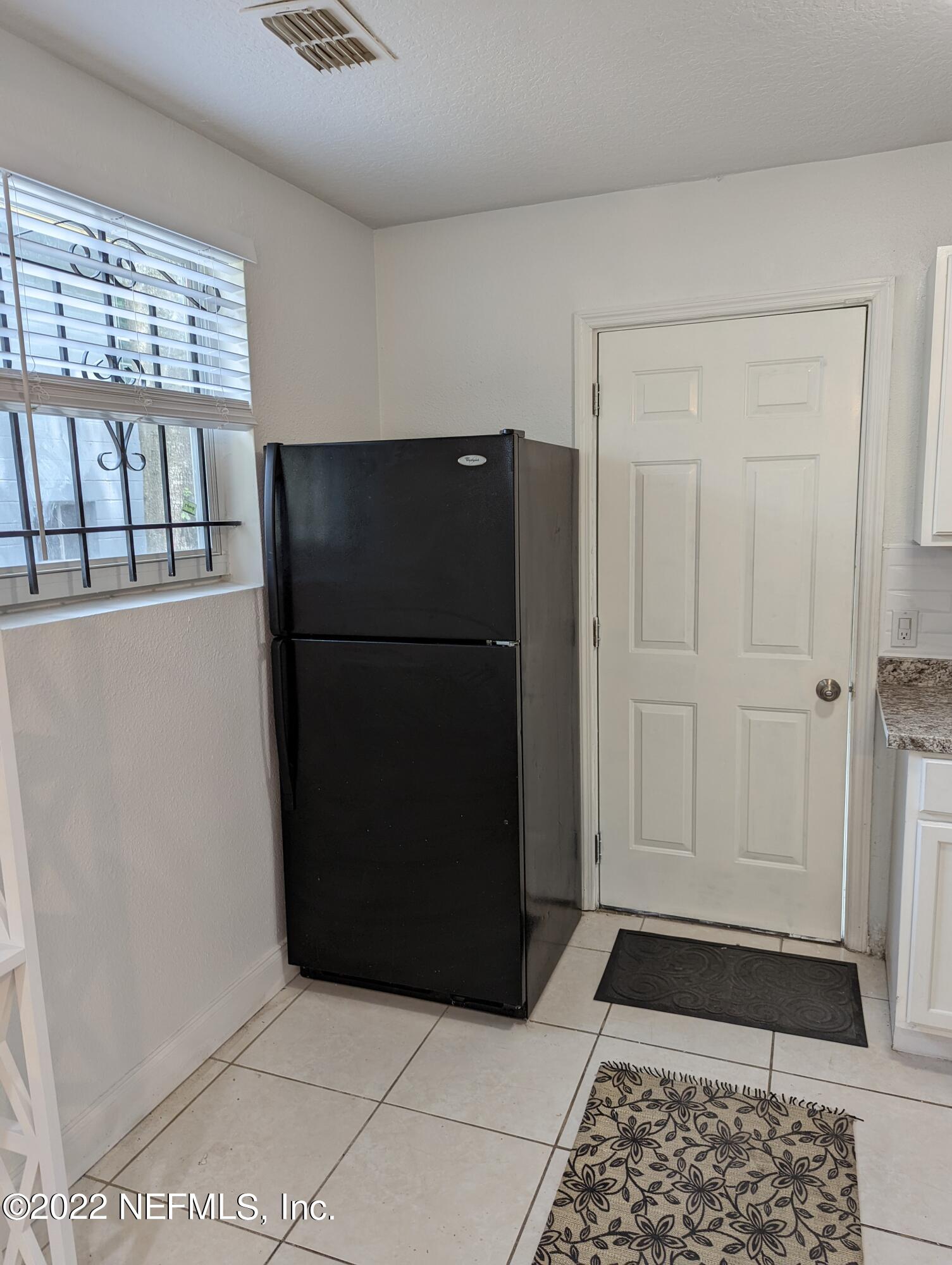 2171 Morehouse Road Jacksonville, FL 32209 - Photo 15 of 17 a refrigerator freezer sitting inside of a kitchen