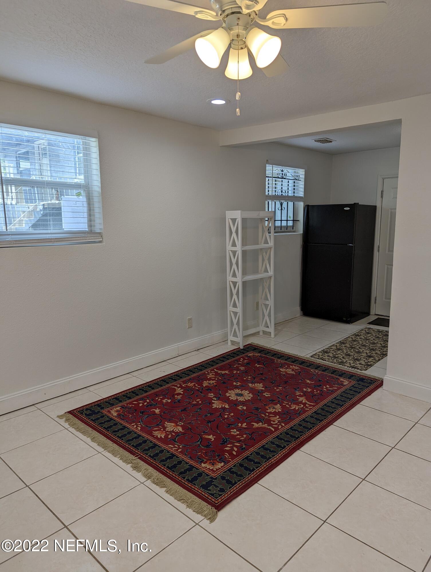 2171 Morehouse Road Jacksonville, FL 32209 - Photo 7 of 17 a living room with hard wood floor and a rug