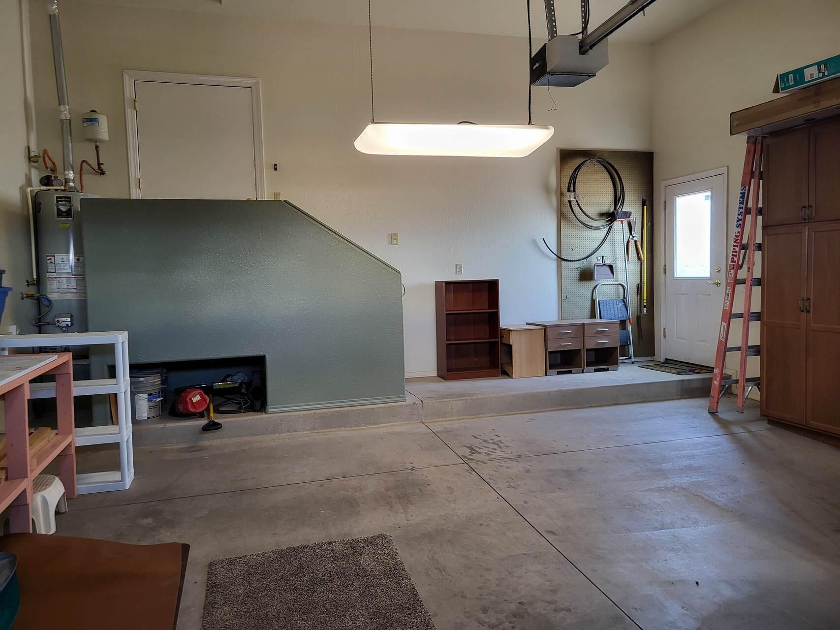 1120 South Sycamore Circle Payson, AZ 85541 - Photo 30 of 44 an empty room with wooden floor book shelf and a window