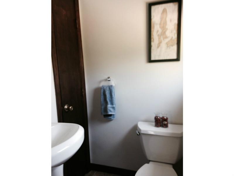 27 Norman Road Jamestown, RI 02835 - Photo 18 of 25 Bathroom. Ensuite half bath with new fixtures.