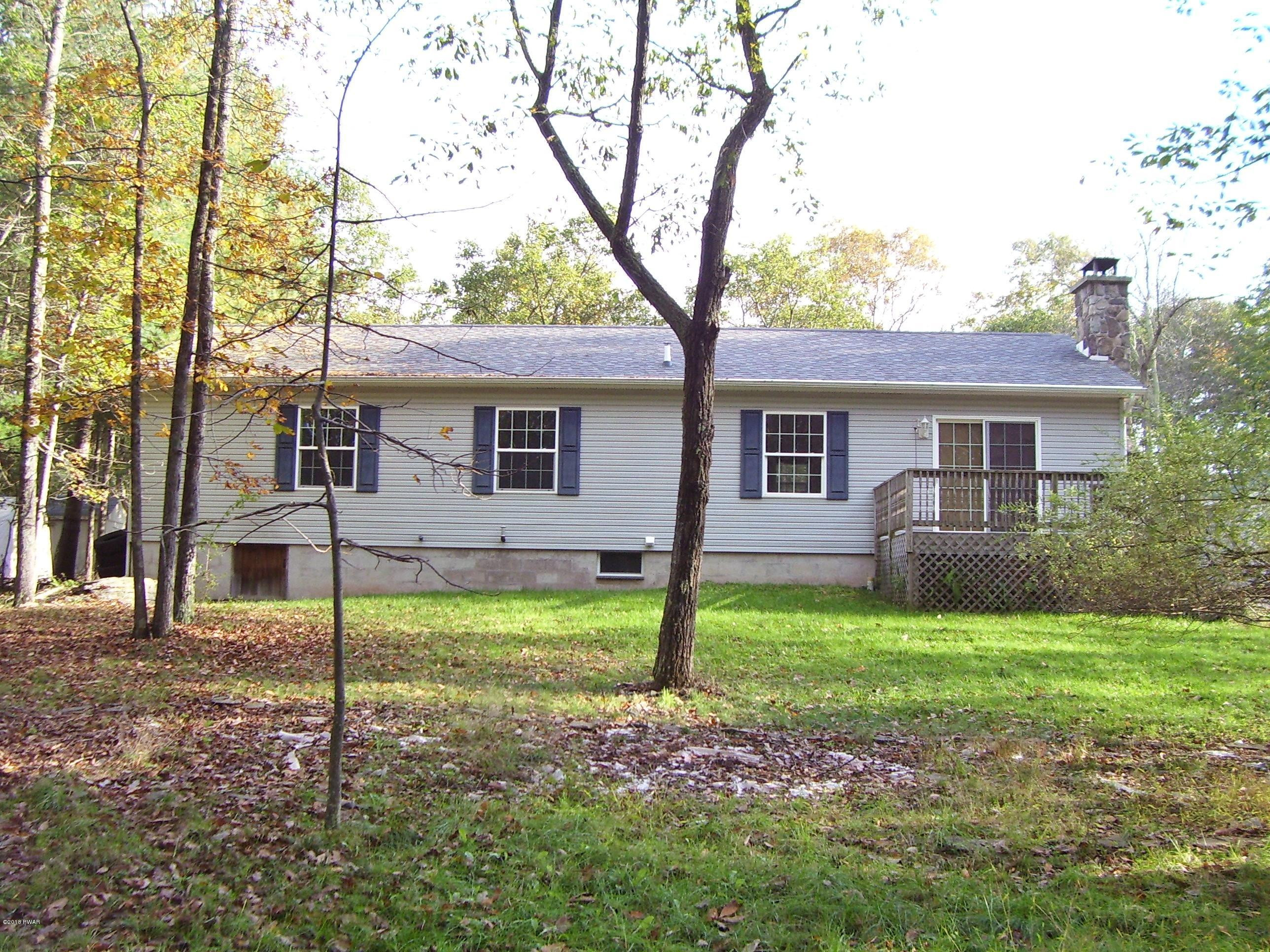 13 W Road Hawley, PA 18428 - Photo 3 of 26 a house that has a tree in front of the house