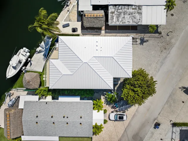 a view of an empty room and kitchen