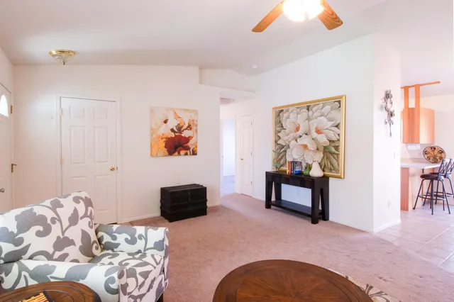 a bedroom with furniture and wooden floor