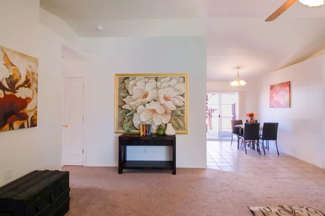 a living room with furniture and a piano