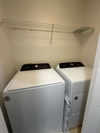 a utility room with dryer and washer