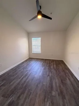 a view of an empty room with windows