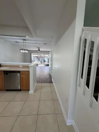 a kitchen with a stove top oven and cabinets