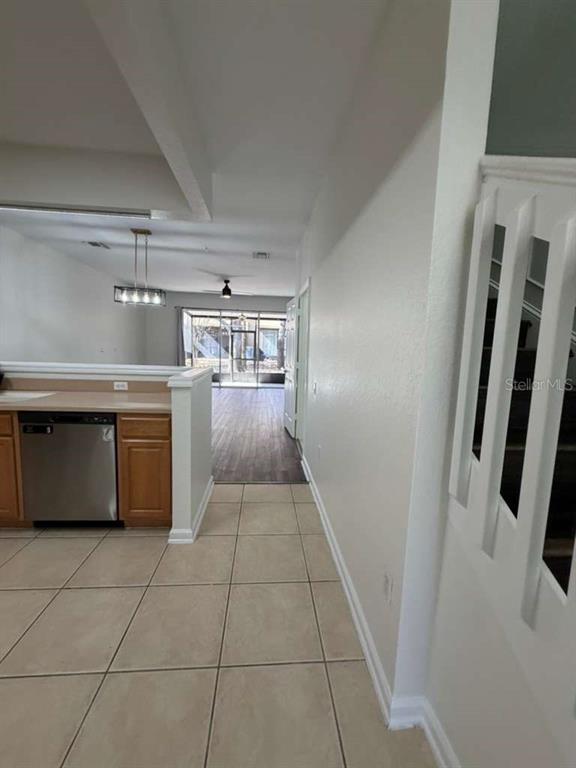 2838 Villafuerte Point, Unit 104 Orlando, FL 32835 - Photo 3 of 17 a kitchen with a stove top oven and cabinets