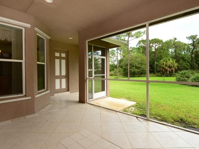 12557 154th Road North Jupiter, FL 33478 - Photo 36 of 38 a view of a garden from a porch