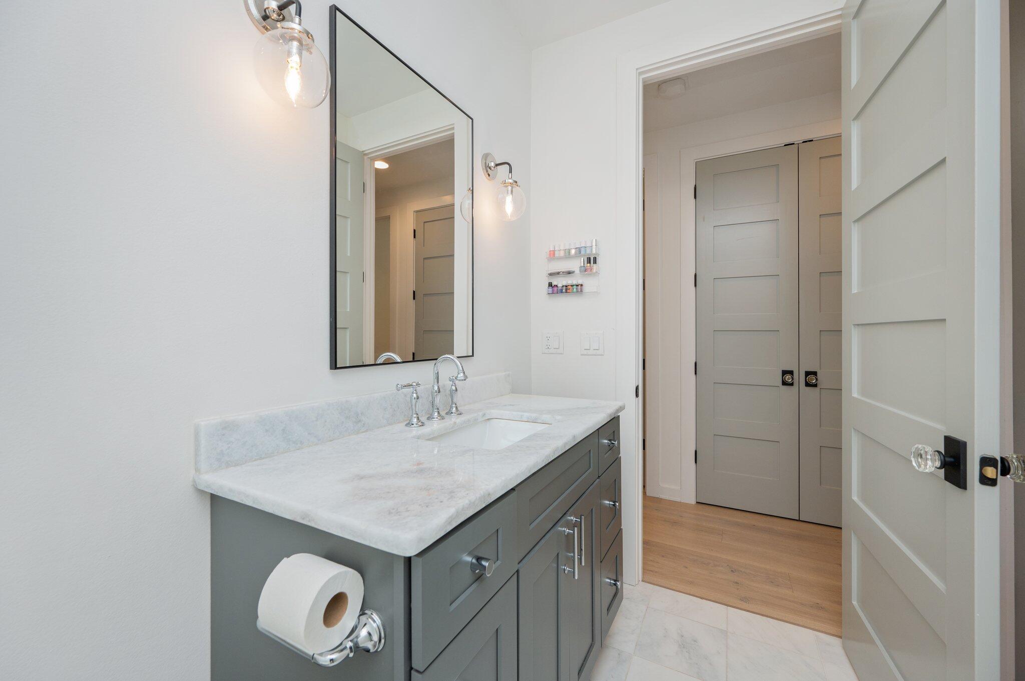 164 Bay Trace Santa Rosa Beach, FL 32459 - Photo 75 of 90 a bathroom with a granite countertop sink and a mirror