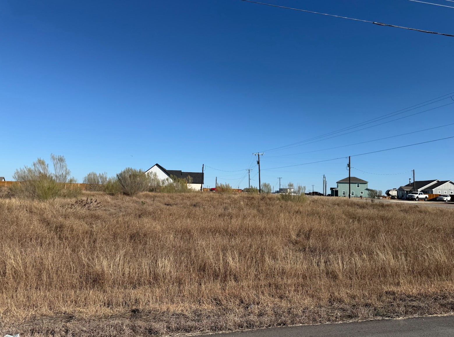 109 Desperado Loop Del Valle, TX 78617 - Photo 1 of 9 a view of a dry yard