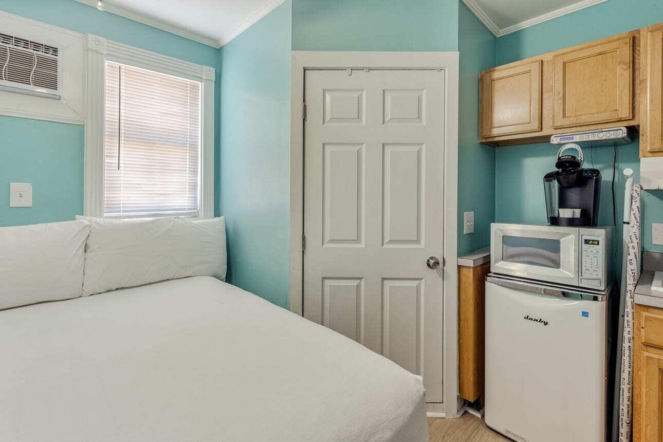 1016 Howe Street, Unit 5 Key West, FL 33040 - Photo 11 of 26 a bedroom with a bed and a window