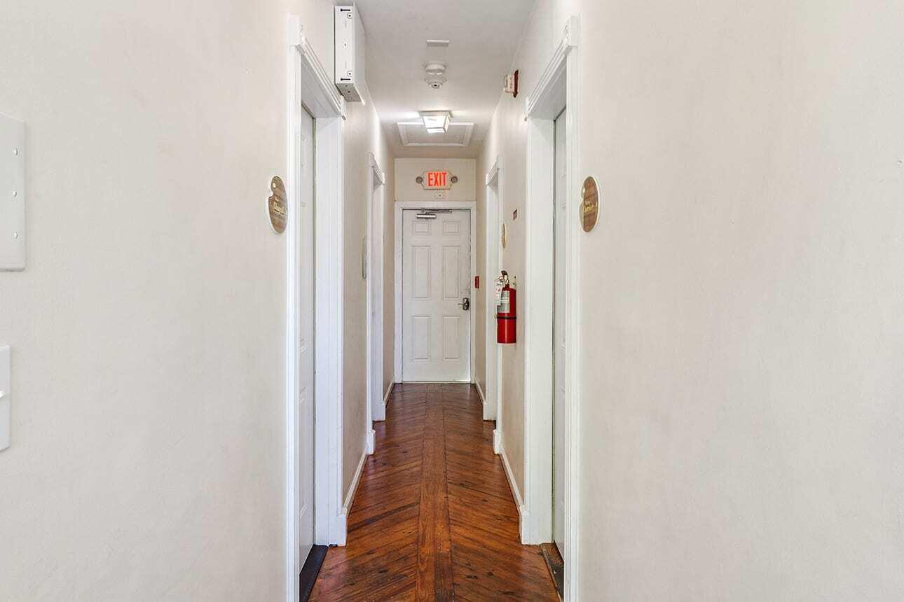 1016 Howe Street, Unit 5 Key West, FL 33040 - Photo 18 of 26 a view of a hallway with wooden floor