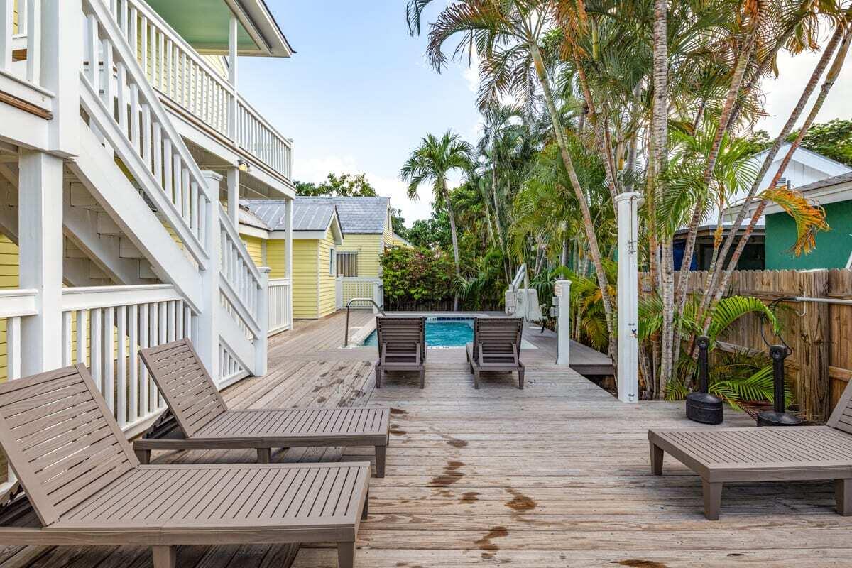 1016 Howe Street, Unit 5 Key West, FL 33040 - Photo 4 of 26 a view of a house with backyard and sitting area