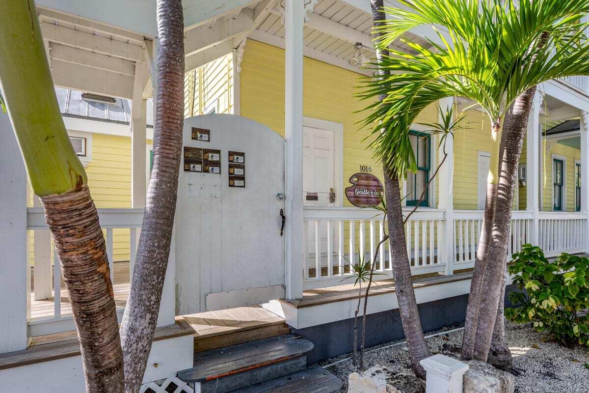 1016 Howe Street, Unit 5 Key West, FL 33040 - Photo 9 of 26 a balcony with furniture and a potted plant