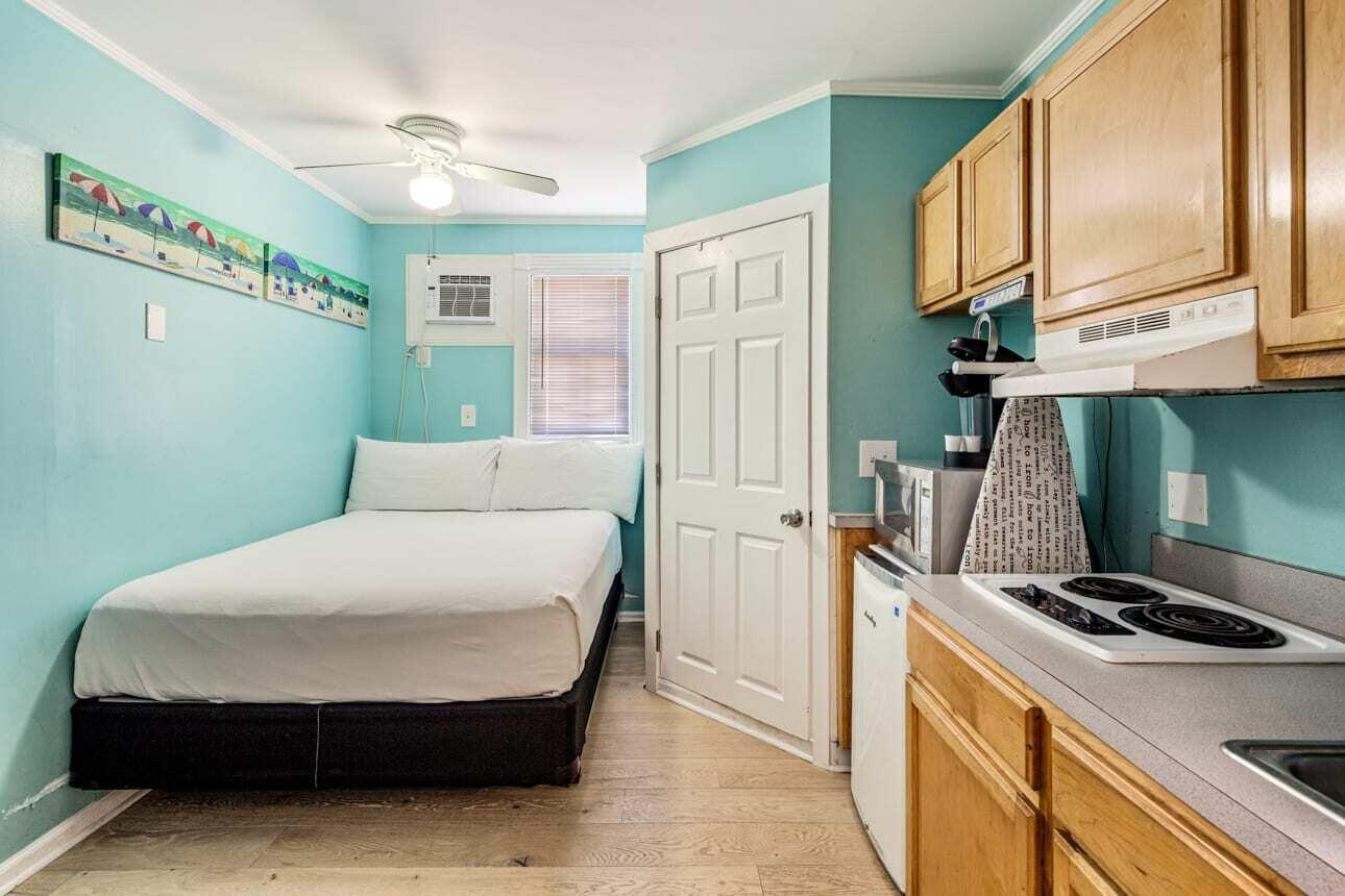 1016 Howe Street, Unit 5 Key West, FL 33040 - Photo 10 of 26 a bed room with a bed and a television