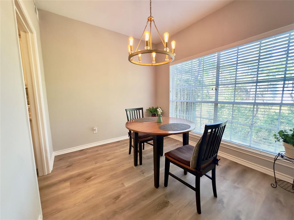 6315 Campbell Road, Unit 509 Dallas, TX 75248 - Photo 4 of 6 a view of a dining room with furniture window and outside view