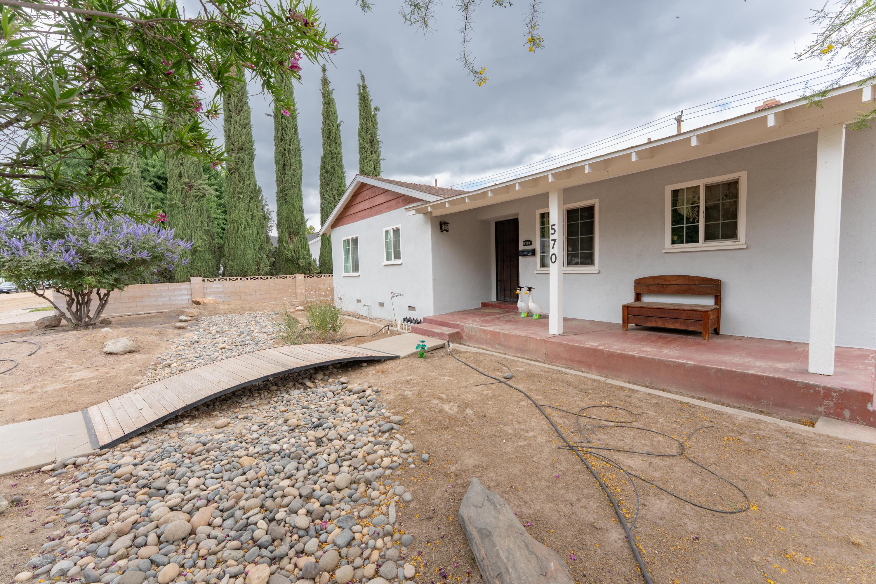 570 North Birch Avenue Reedley, CA 93654 - Photo 8 of 52 a front view of a house with a yard