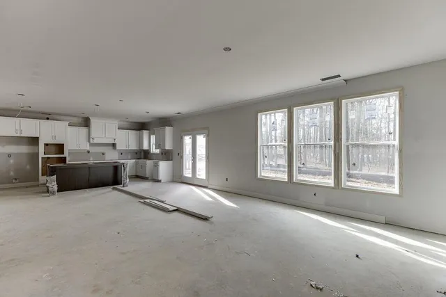 a kitchen with cabinets and stainless steel appliances