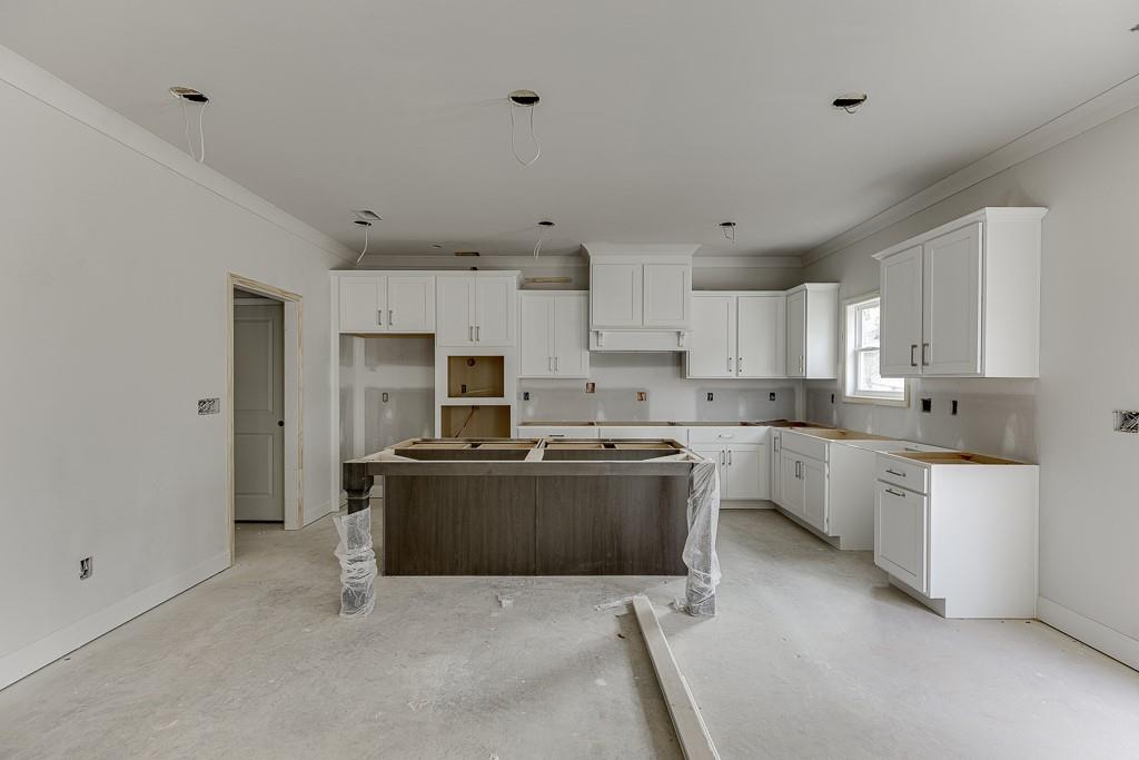 1075 Poppy Lane Jefferson, GA 30549 - Photo 13 of 36 a kitchen with cabinets and stainless steel appliances
