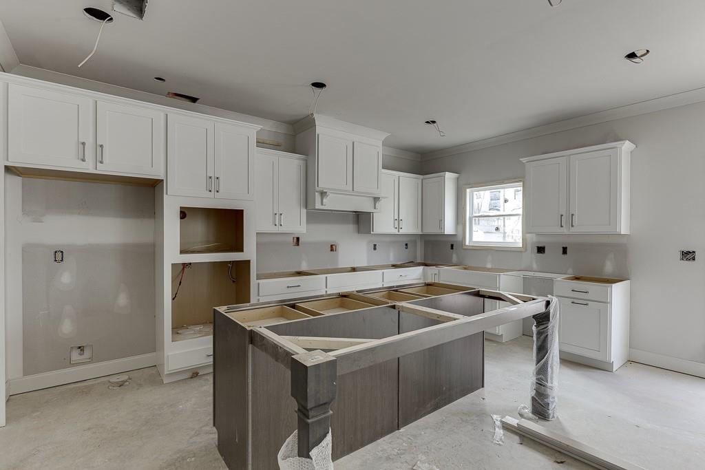1075 Poppy Lane Jefferson, GA 30549 - Photo 14 of 36 a kitchen that has a sink and a stove in it