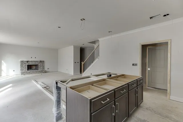 a kitchen that has a sink and a stove in it