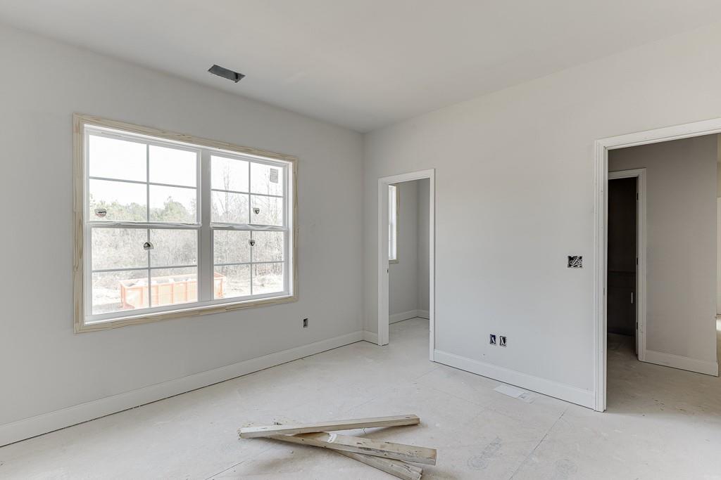 1075 Poppy Lane Jefferson, GA 30549 - Photo 22 of 36 an empty room with windows