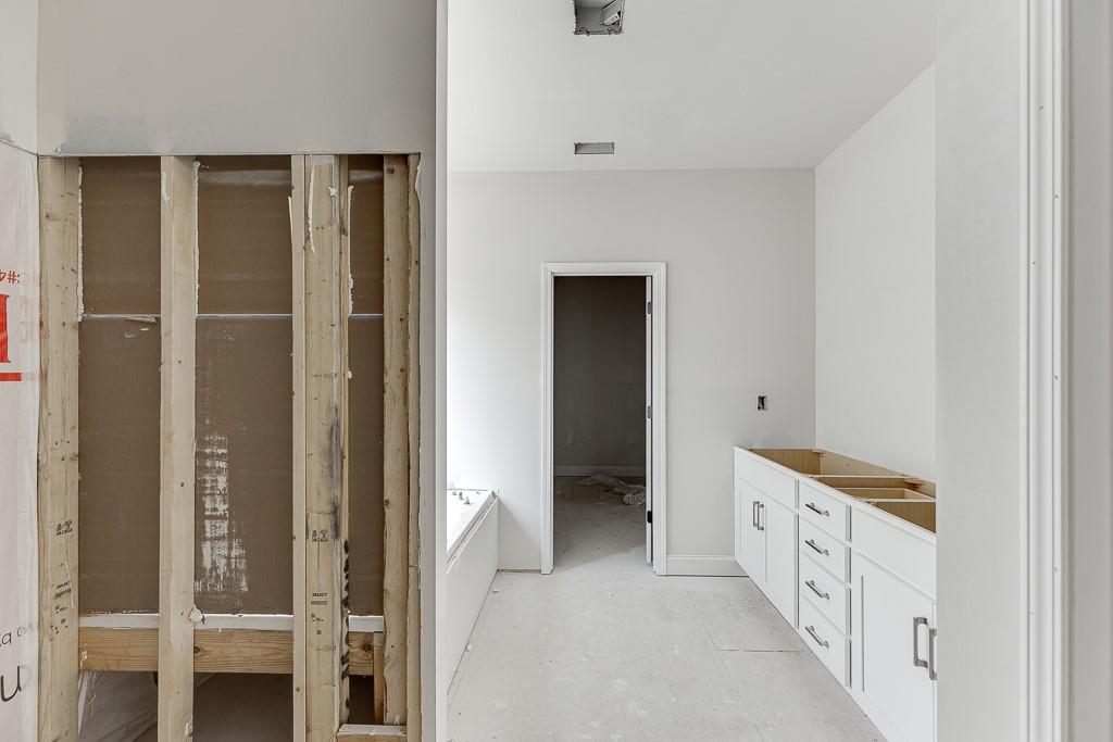 1075 Poppy Lane Jefferson, GA 30549 - Photo 29 of 36 a bathroom with a double vanity sink and a mirror